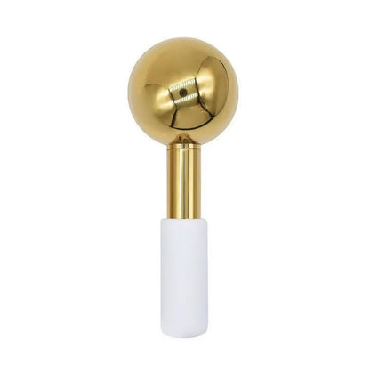 Gold-finished stainless steel ice facial massage roller reducing puffiness and boosting circulation for refreshed skin